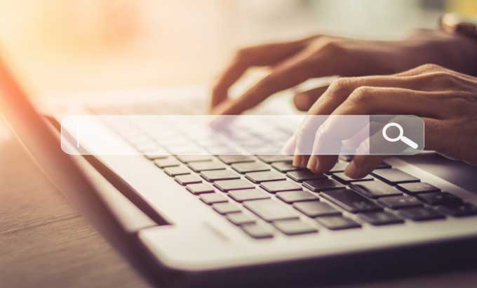 Person using a laptop to optimize their site search experience